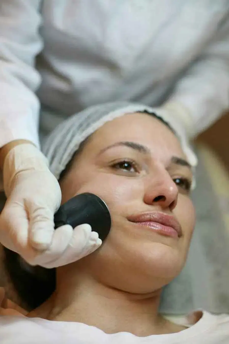 A beautician performing a treatment, highlighting the importance of professional services for local salons in the North East