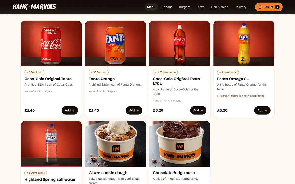 The Hank Marvins drinks menu: Coca-Cola and Fanta cans and bottles photographed in a red studio set, each card showing its pack size and price