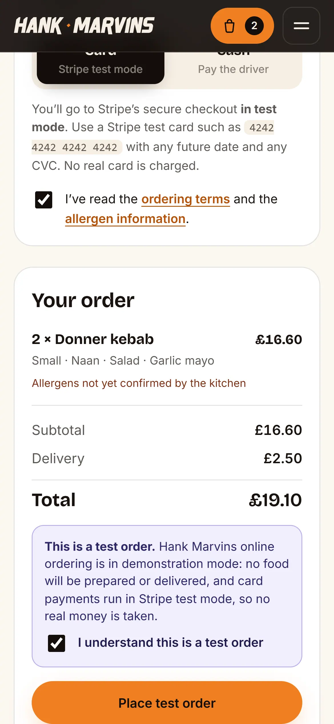 The checkout on a phone, with Stripe test-mode card payment selected, the order total and a Place test order button
