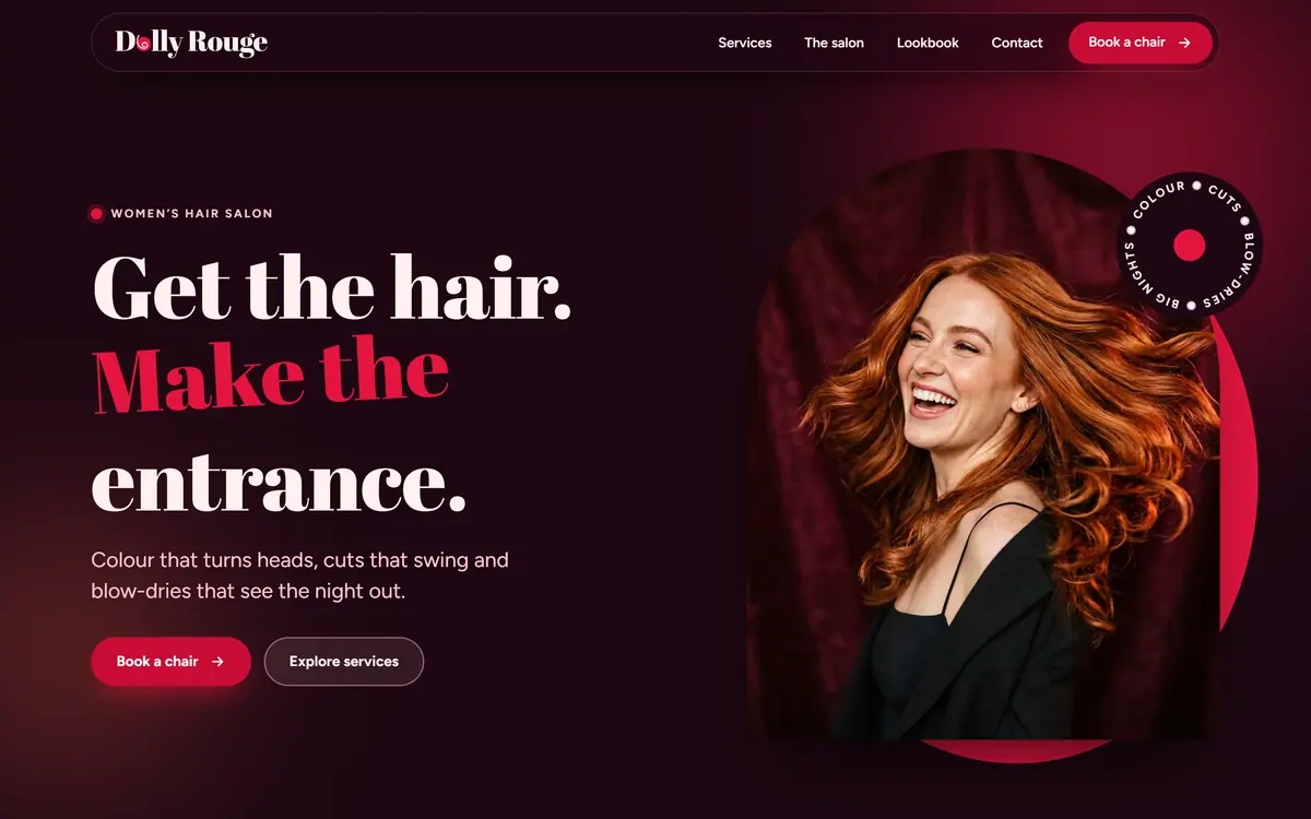 The Dolly Rouge homepage on a desktop screen: the headline Get the hair. Make the entrance. beside a laughing woman with long copper hair in an arched frame on a rouge disc