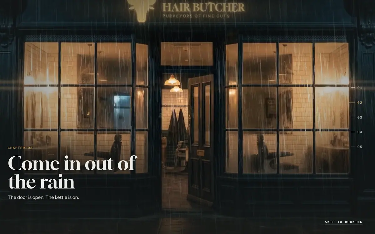 The Hair Butcher homepage film at the shop door: the glowing shopfront in the rain with the caption Come in out of the rain