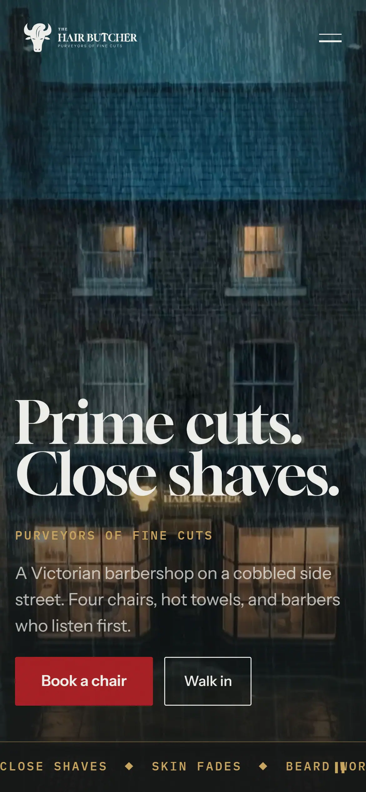 The Hair Butcher homepage on a phone: the headline Prime cuts. Close shaves. over the rainy street, with Book a chair and Walk in buttons