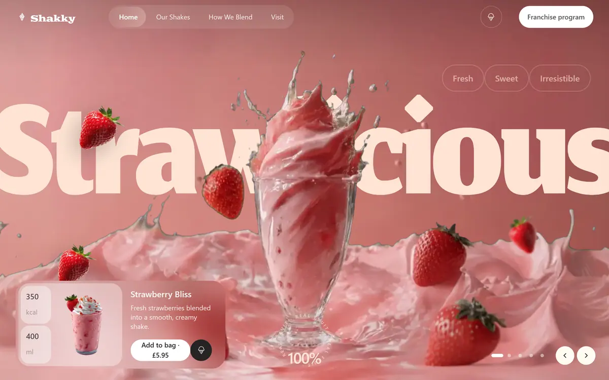The Shakky hero on a desktop screen: a strawberry thick shake in a tall glass on a pink plate, the word Strawlicious set huge behind it, strawberries around it and a product card for Strawberry Bliss