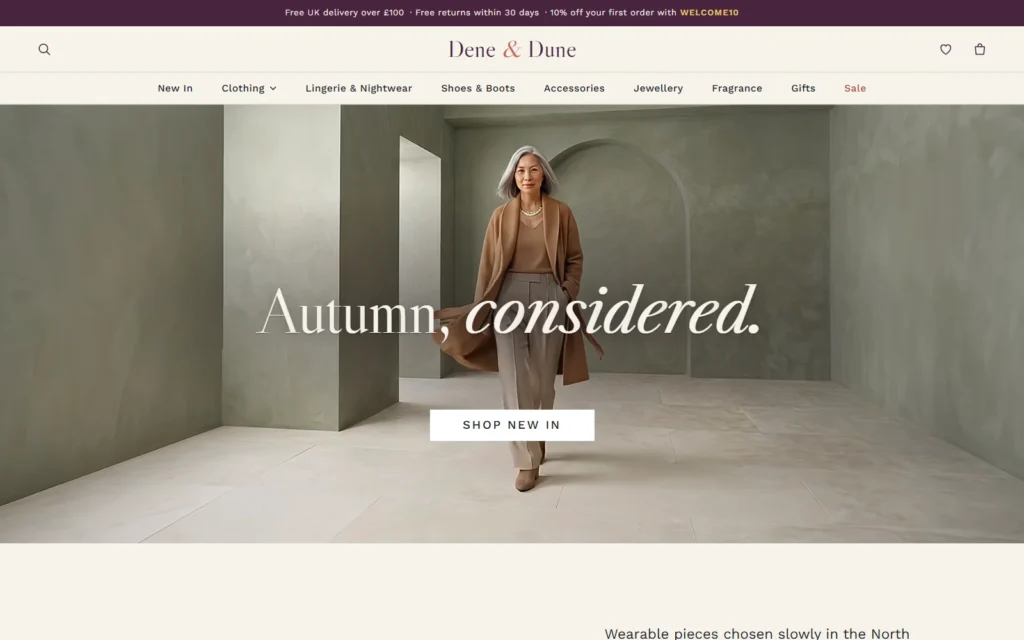 The Dene & Dune homepage on desktop: the headline Autumn, considered. over a campaign film still of a model in a camel coat walking through a sage archway